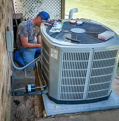 One of our dedicated technicians diagnoses a problem with a customer's AC unit